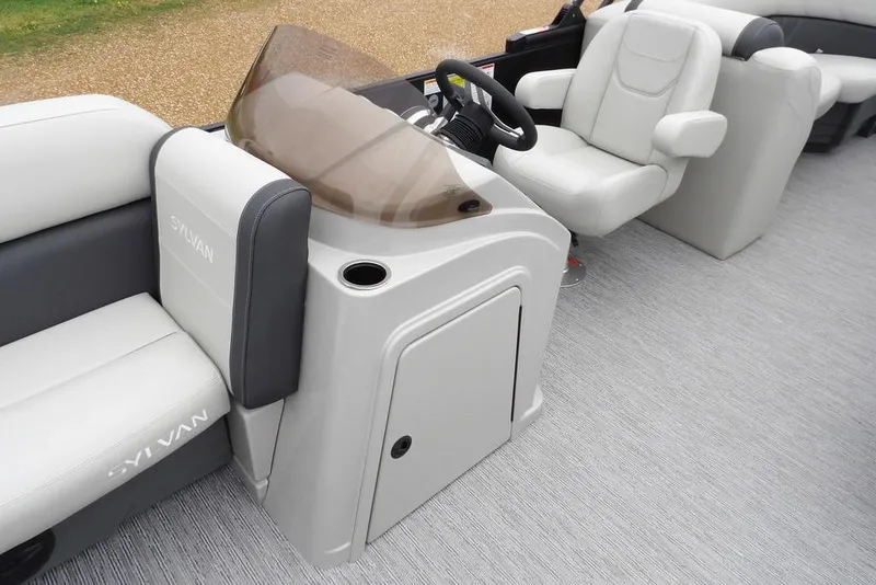 Slide: The Image of 2026 Sylvan 8522 LZ boat interior with modern seating and steering console. - 43