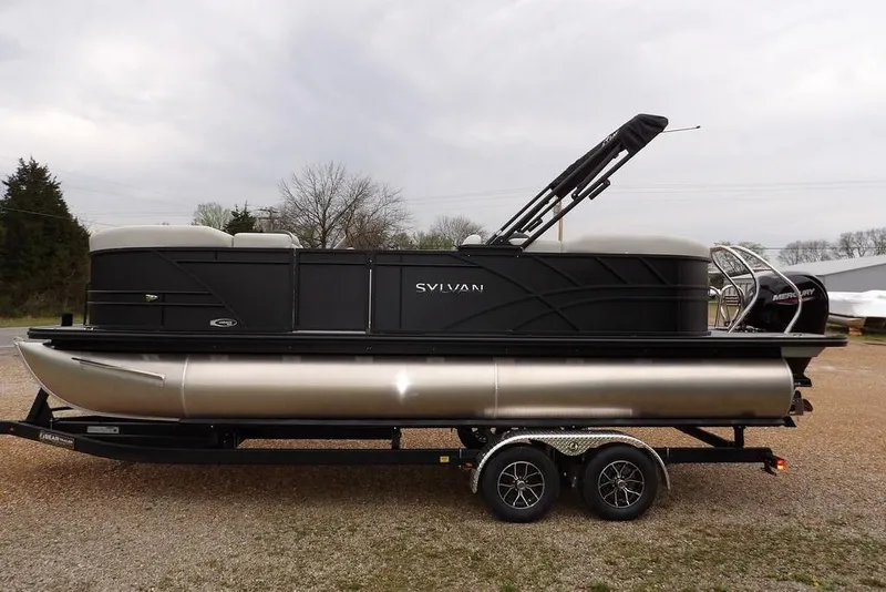 Slide: The Image of 2026 Sylvan 8522 LZ pontoon boat on trailer, featuring sleek black design. - 5