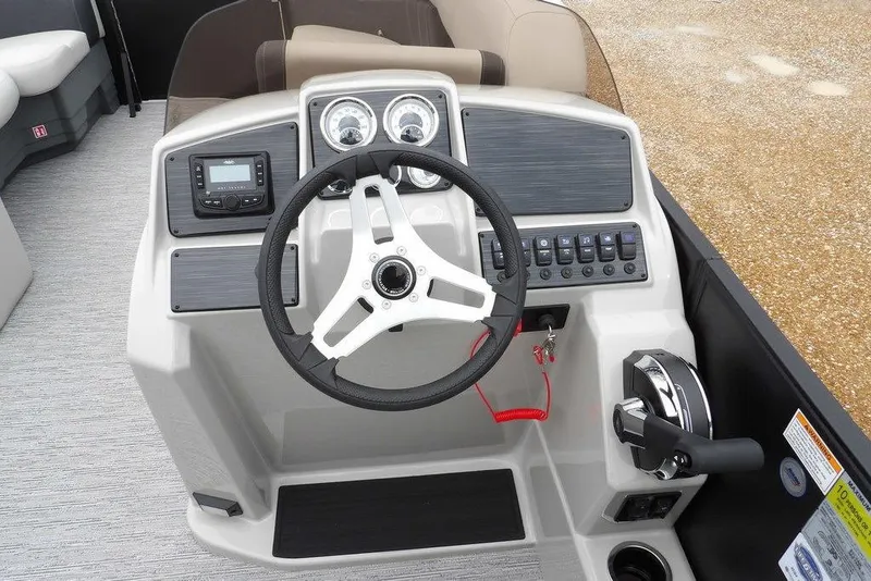 Slide: The Image of Steering console of 2026 Sylvan 8522 LZ boat with modern controls and dashboard. - 9