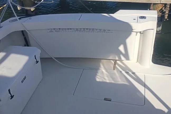 Slide: The Image of 2000 Luhrs Tournament 290 Open boat deck with storage and cooler. - 13