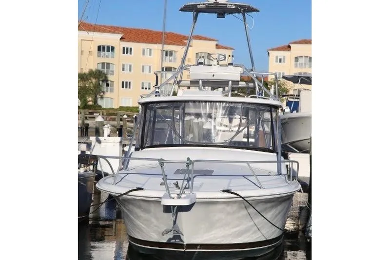 Slide: The Image of 2000 Luhrs Tournament 290 Open boat docked at marina, front view. - 3