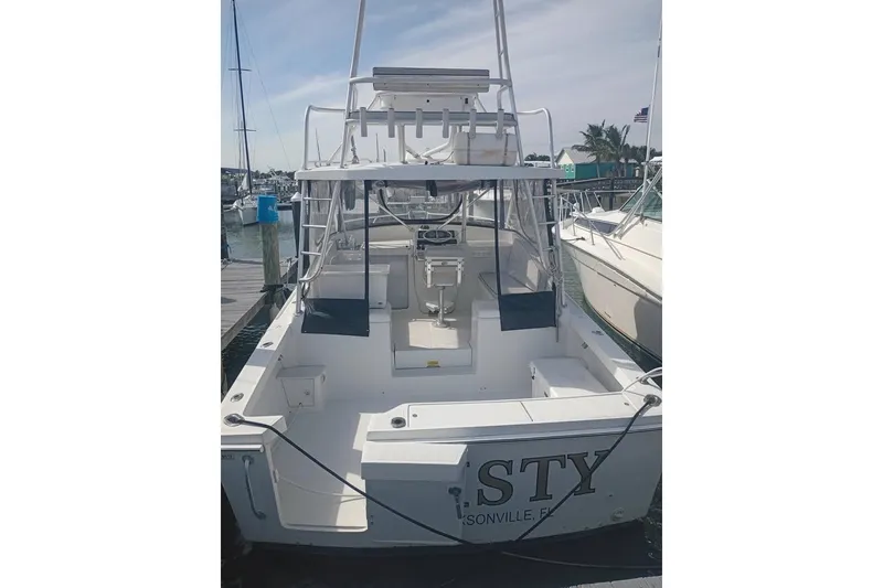 Slide: The Image of 2000 Luhrs Tournament 290 Open boat docked at marina, rear view. - 4