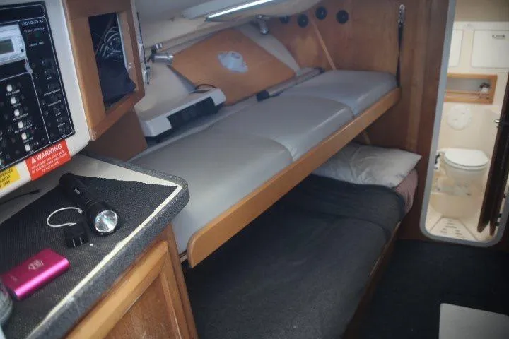Slide: The Image of Interior of 2000 Luhrs Tournament 290 Open boat with bunk beds and control panel. - 9
