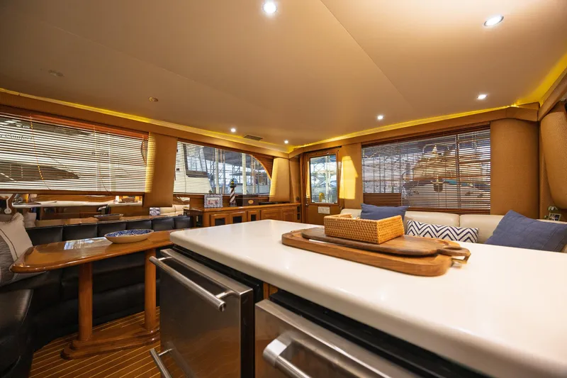 Slide: The Image of Luxurious interior of a 1998 Viking 50 Convertible yacht with elegant furnishings and ambient lighting. - 11