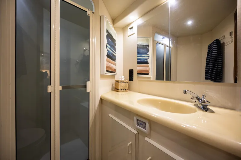 Slide: The Image of Bathroom interior of 1998 Viking 50 Convertible yacht with shower and sink. - 18