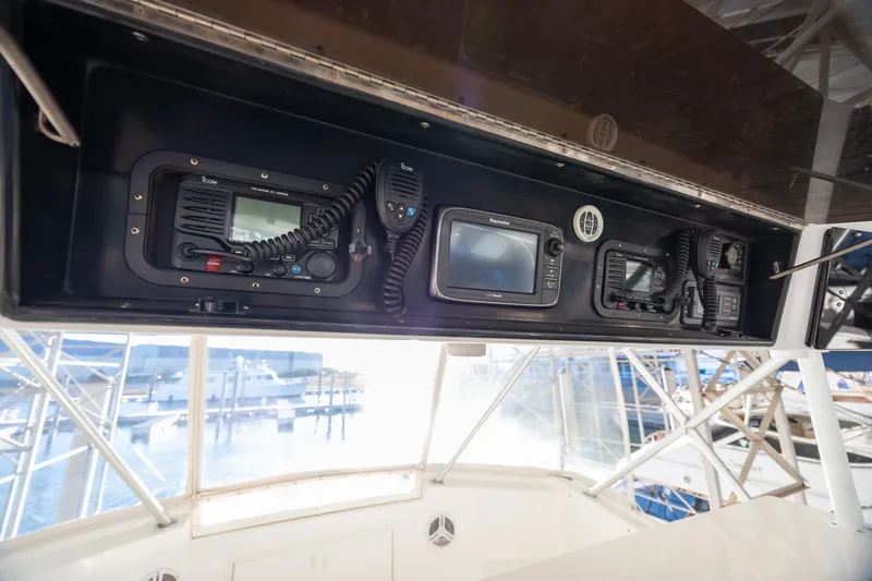 Slide: The Image of Control panel of a 1998 Viking 50 Convertible yacht with navigation equipment. - 31