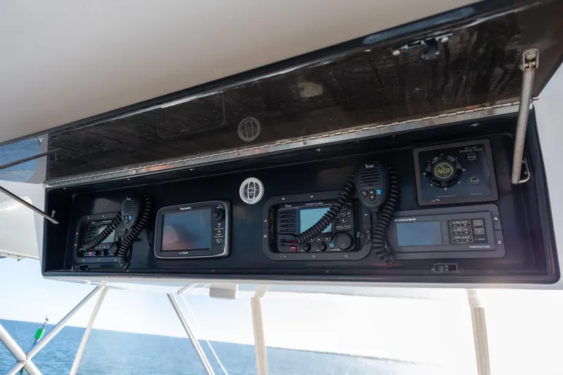 Slide: The Image of Control panel of a 1998 Viking 50 Convertible yacht with navigation equipment. - 32