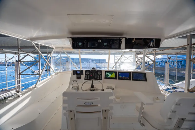 Slide: The Image of Cockpit of 1998 Viking 50 Convertible yacht with navigation equipment and ocean view. - 36