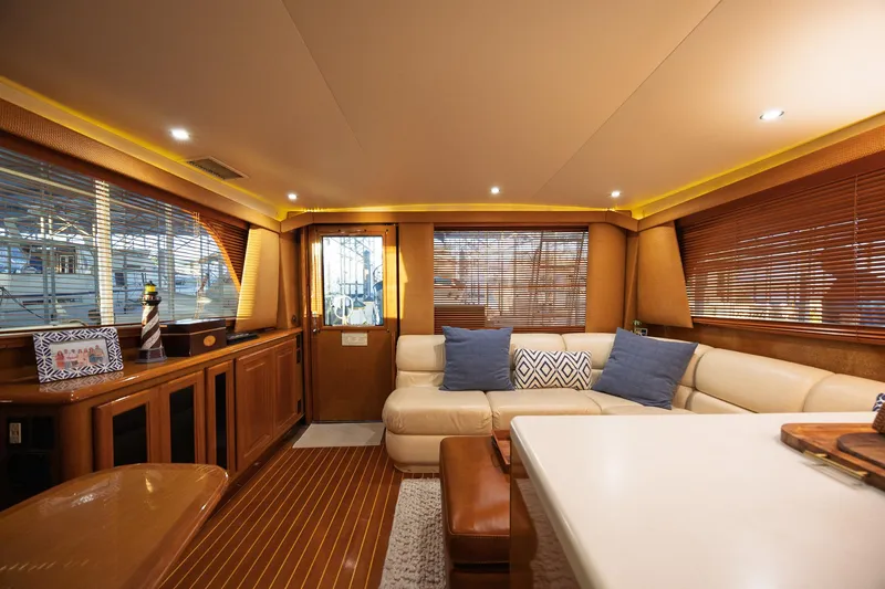 Slide: The Image of Luxurious interior of a 1998 Viking 50 Convertible yacht with elegant seating and decor. - 6