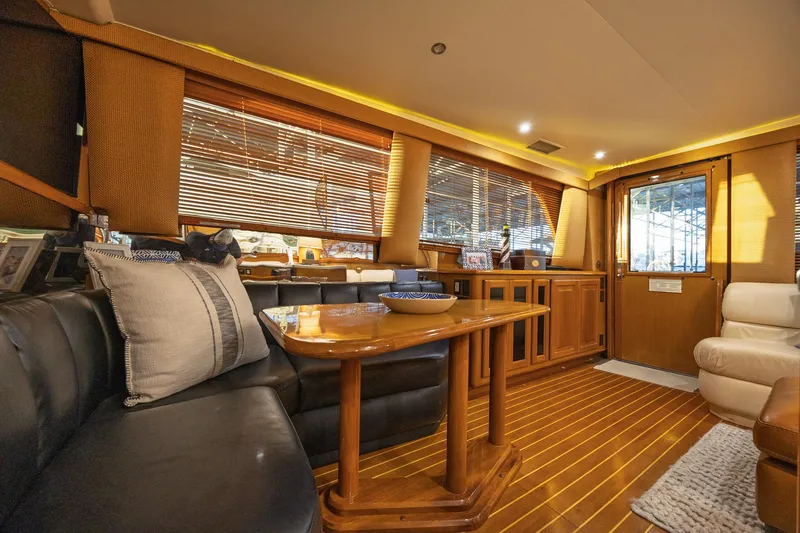 Slide: The Image of Luxurious interior of a 1998 Viking 50 Convertible yacht with elegant wood finishes. - 7