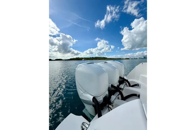 Slide: The Image of 2022 Intrepid 407 Nomad SE boat engines on a sunny day, ocean view. - 6
