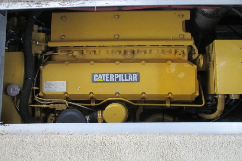Slide: The Image of Engine compartment of a 1997 Mainship 350 Trawler with Caterpillar engine. - 49