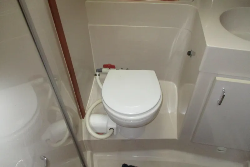 Slide: The Image of Bathroom interior of 1997 Mainship 350 Trawler with toilet and sink. - 40