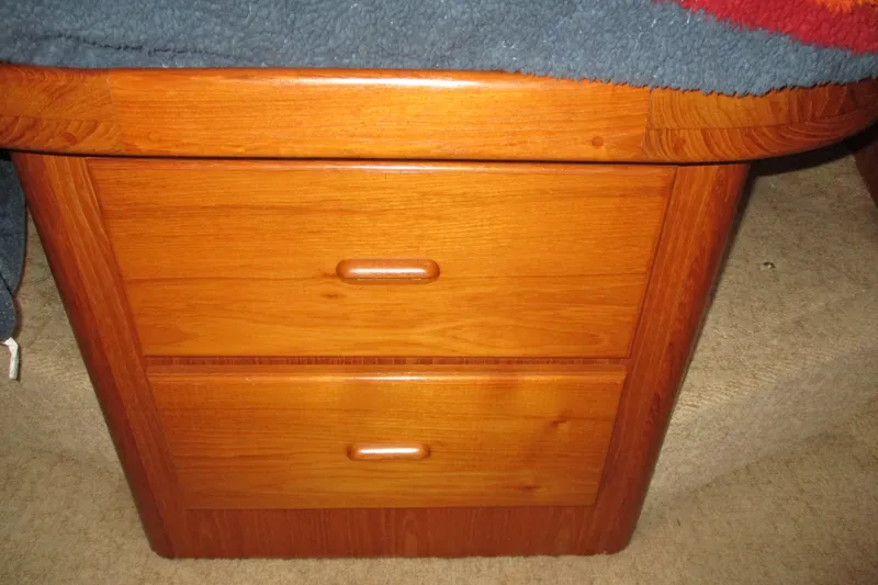 Slide: The Image of Wooden cabinet with two drawers inside a 1997 Mainship 350 Trawler boat. - 44