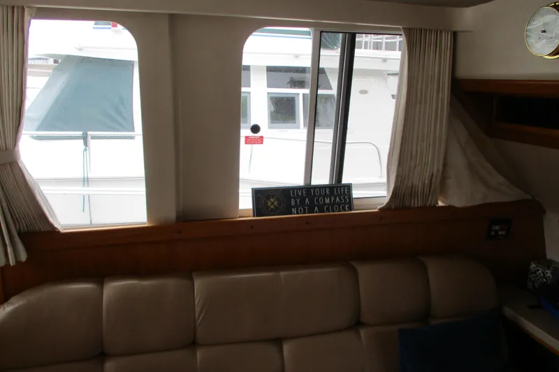 Slide: The Image of Interior view of 1997 Mainship 350 Trawler with window and motivational sign. - 47