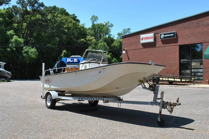 Slide: The Image of 1992 Boston Whaler 17 Montauk boat on trailer outside Yamaha dealership. - 12