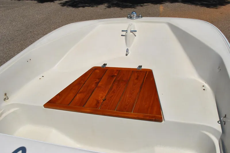 Slide: The Image of 1992 Boston Whaler 17 Montauk boat interior with wooden deck detail. - 18