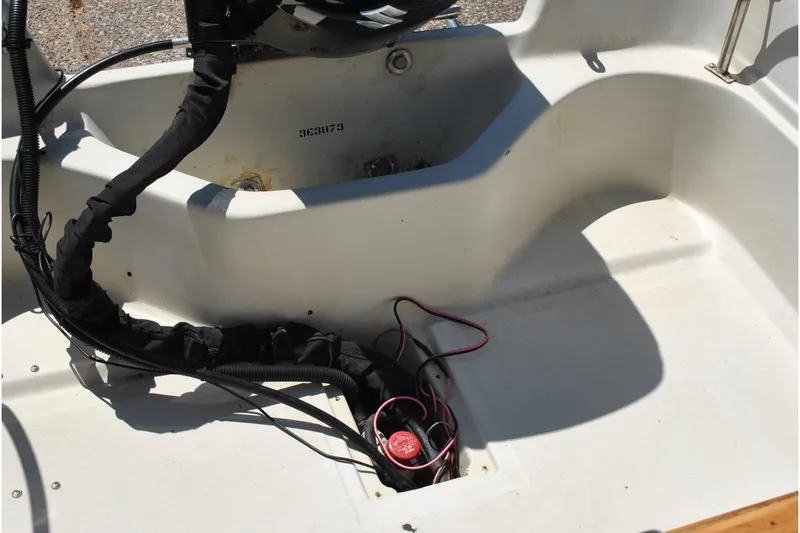 Slide: The Image of Interior view of a 1992 Boston Whaler 17 Montauk boat showing wiring and components. - 21