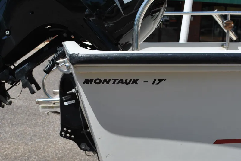 Slide: The Image of 1992 Boston Whaler 17 Montauk boat, close-up of model name on hull. - 4