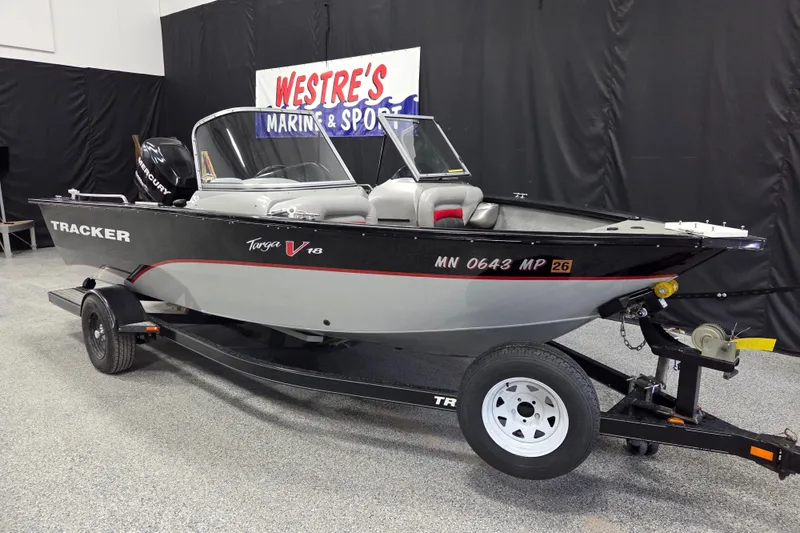 The Image of 2010 Tracker Targa V-18 WT boat on trailer in showroom. - 1