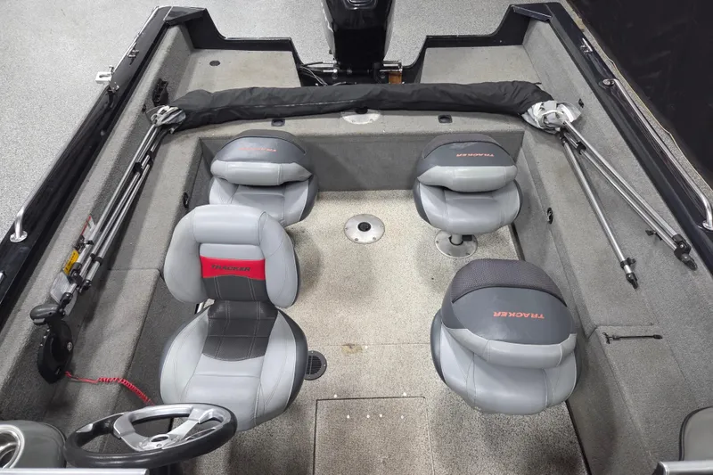 Slide: The Image of 2010 Tracker Targa V-18 WT boat interior with four gray seats and steering wheel. - 10