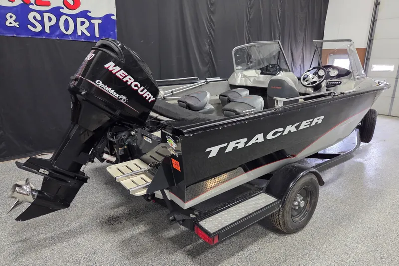 Slide: The Image of 2010 Tracker Targa V-18 WT boat with Mercury outboard motor in showroom. - 3