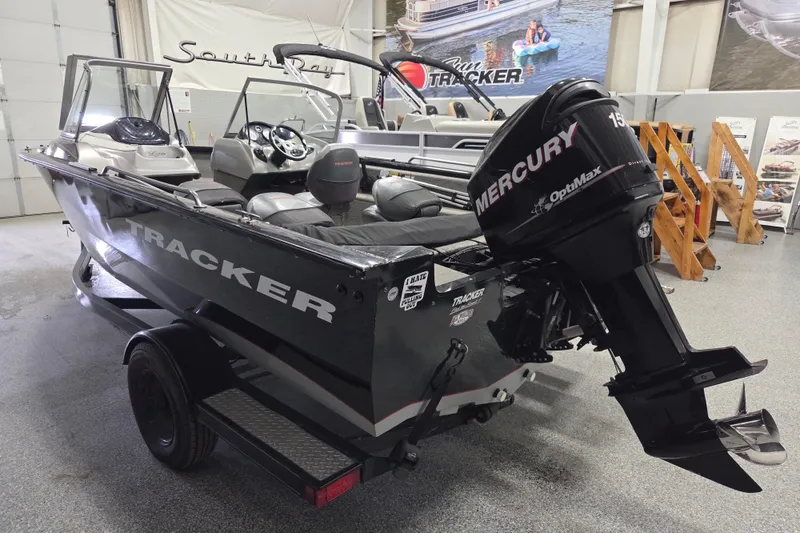 Slide: The Image of 2010 Tracker Targa V-18 WT boat with Mercury OptiMax engine in showroom. - 5