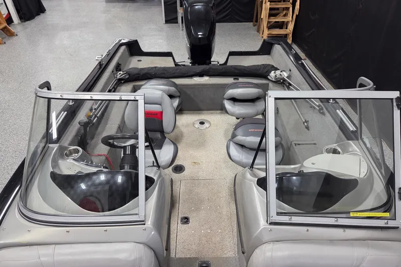 Slide: The Image of 2010 Tracker Targa V-18 WT boat interior with seating and steering console. - 9