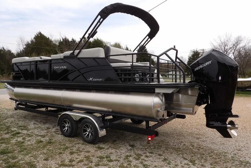 Slide: The Image of 2026 Sylvan X5 CLZ pontoon boat on trailer with Mercury outboard motor. - 10