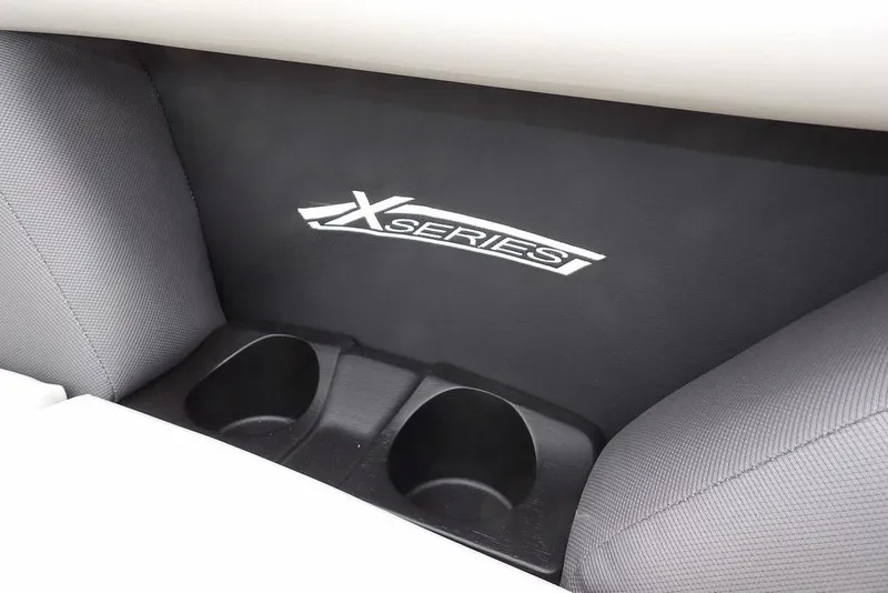 Slide: The Image of Interior of 2026 Sylvan X5 CLZ featuring X Series branding and cup holders. - 14