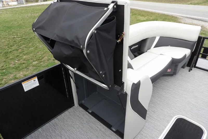 Slide: The Image of 2026 Sylvan X5 CLZ boat interior with seating and storage compartment. - 15
