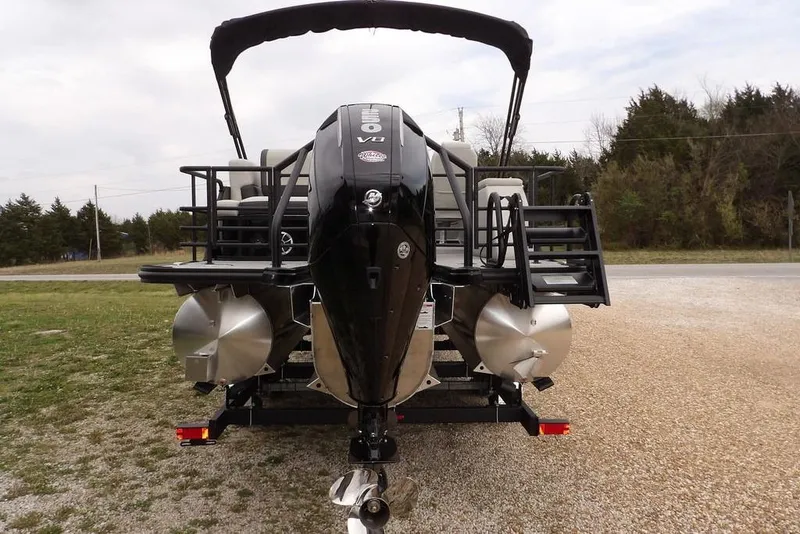 Slide: The Image of 2026 Sylvan X5 CLZ pontoon boat with powerful V8 engine, parked outdoors. - 17