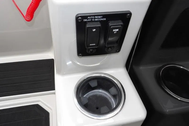 Slide: The Image of Control panel and cup holder in 2026 Sylvan X5 CLZ boat interior. - 25