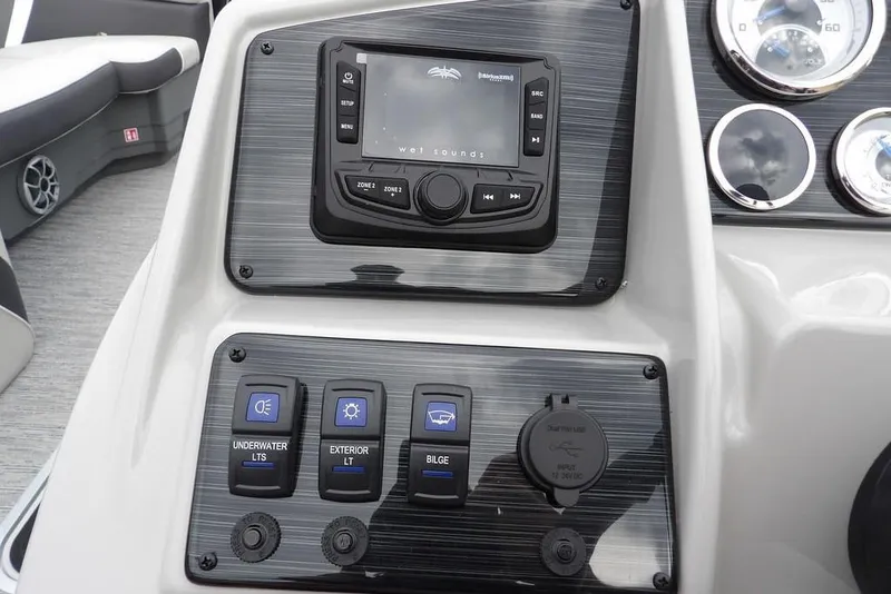 Slide: The Image of Control panel of 2026 Sylvan X5 CLZ boat with audio system and switches. - 26