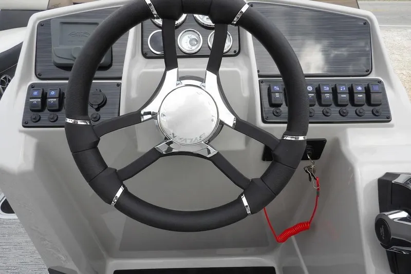 Slide: The Image of Steering wheel and dashboard of 2026 Sylvan X5 CLZ boat. - 27