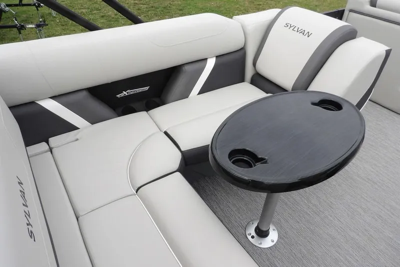 Slide: The Image of Luxurious seating area on 2026 Sylvan X5 CLZ boat with sleek design and table. - 31