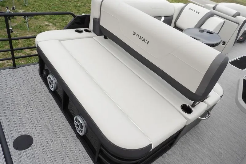 Slide: The Image of Luxurious seating on 2026 Sylvan X5 CLZ boat, featuring cup holders and speakers. - 32