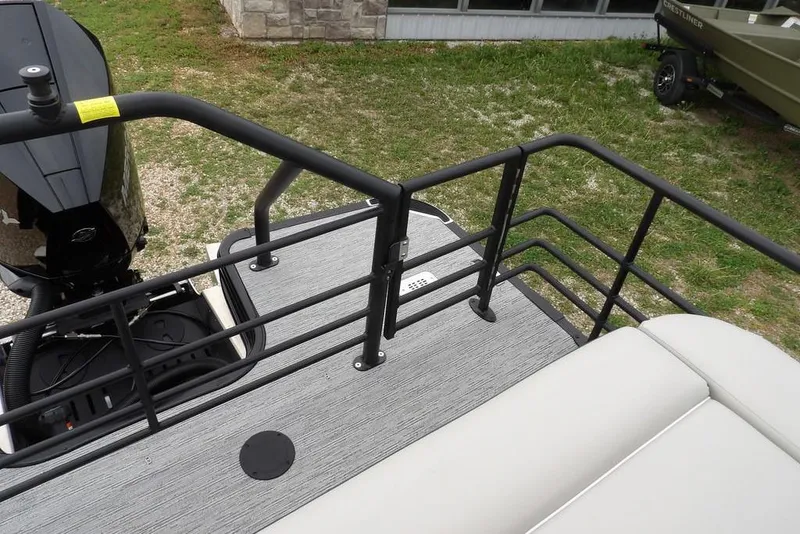 Slide: The Image of Rear deck view of 2026 Sylvan X5 CLZ boat with railing and motor. - 41