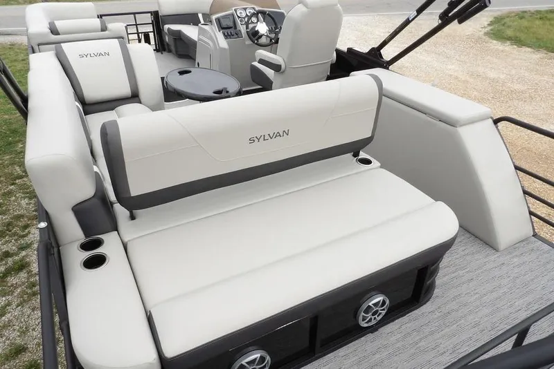 Slide: The Image of 2026 Sylvan X5 CLZ pontoon boat interior with plush seating and modern dashboard. - 44