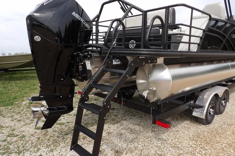 Slide: The Image of 2026 Sylvan X5 CLZ boat with Mercury outboard motor and trailer, rear view. - 46