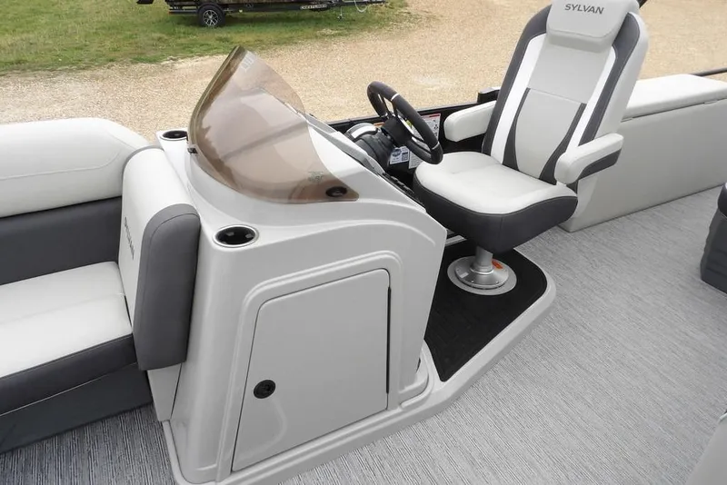 Slide: The Image of 2026 Sylvan X5 CLZ boat interior with helm and captain's chair. - 47