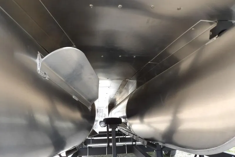 Slide: The Image of Underneath view of 2026 Sylvan X5 CLZ pontoon boat, showcasing sleek aluminum pontoons. - 49