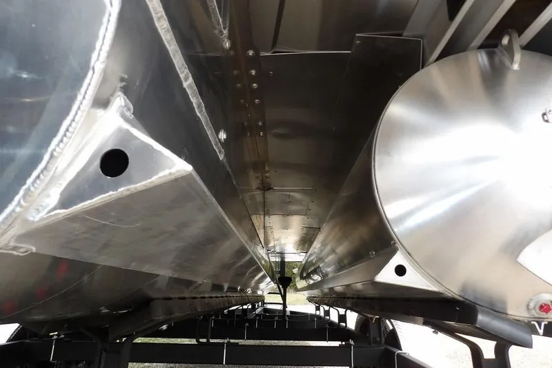 Slide: The Image of Underneath view of 2026 Sylvan X5 CLZ boat, showcasing sleek aluminum pontoons. - 53