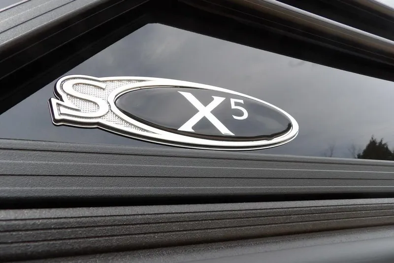 Slide: The Image of Close-up of 2026 Sylvan X5 CLZ logo on a sleek black surface. - 55