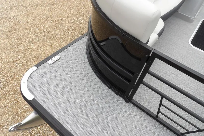 Slide: The Image of 2026 Sylvan X5 CLZ pontoon boat deck with sleek railing and seating. - 6