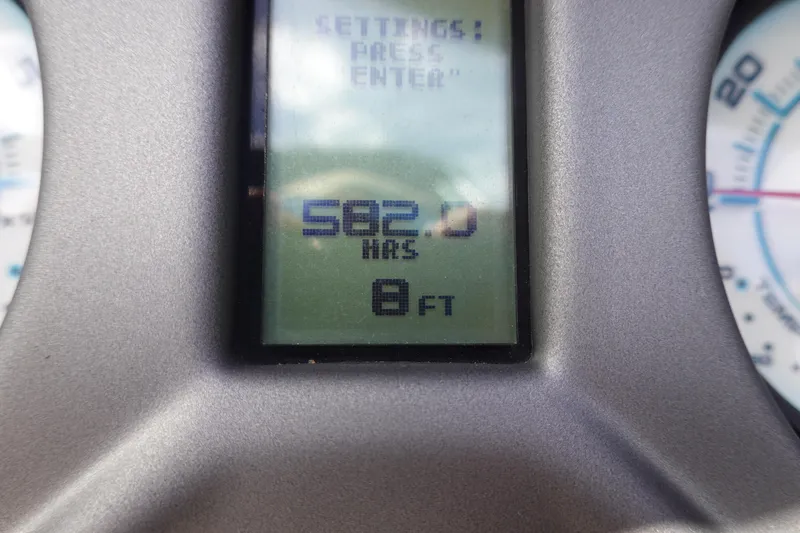 Slide: The Image of Close-up of Axis T23 2019 dashboard displaying 582 hours and 8 feet. - 12