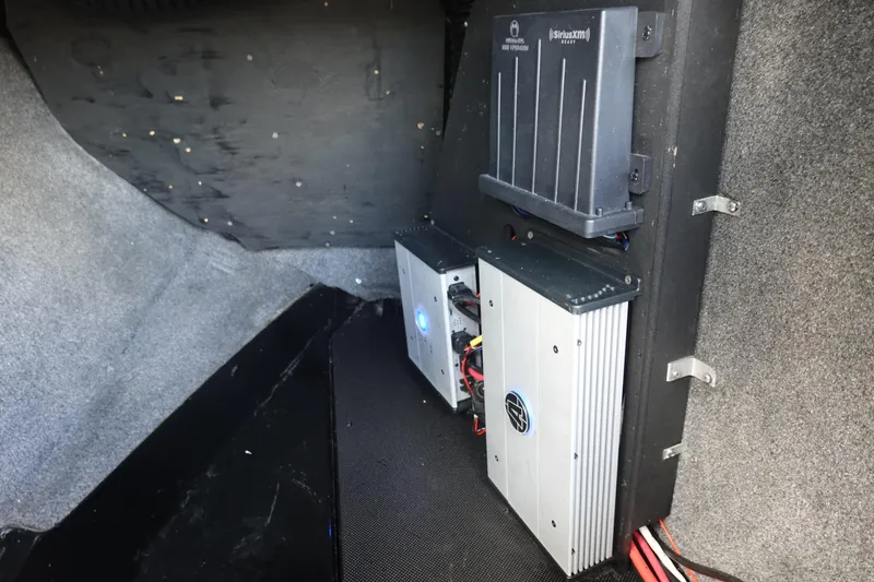 Slide: The Image of 2019 Axis T23 interior showing audio system components and wiring setup. - 18