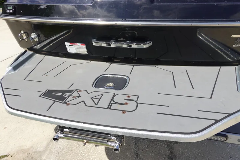 Slide: The Image of 2019 Axis T23 boat rear platform with logo and sleek design. - 5