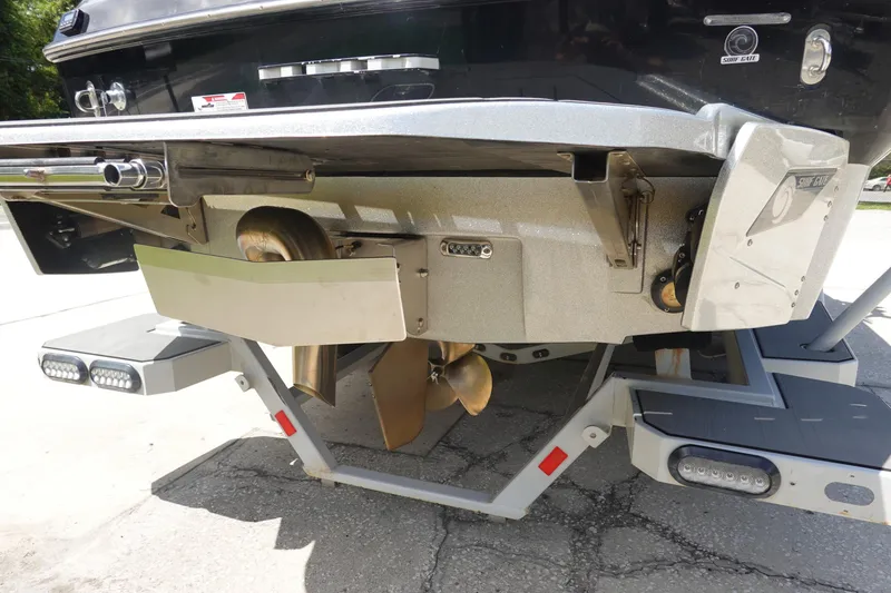 Slide: The Image of Rear view of 2019 Axis T23 boat showing propeller and surf gate system. - 6