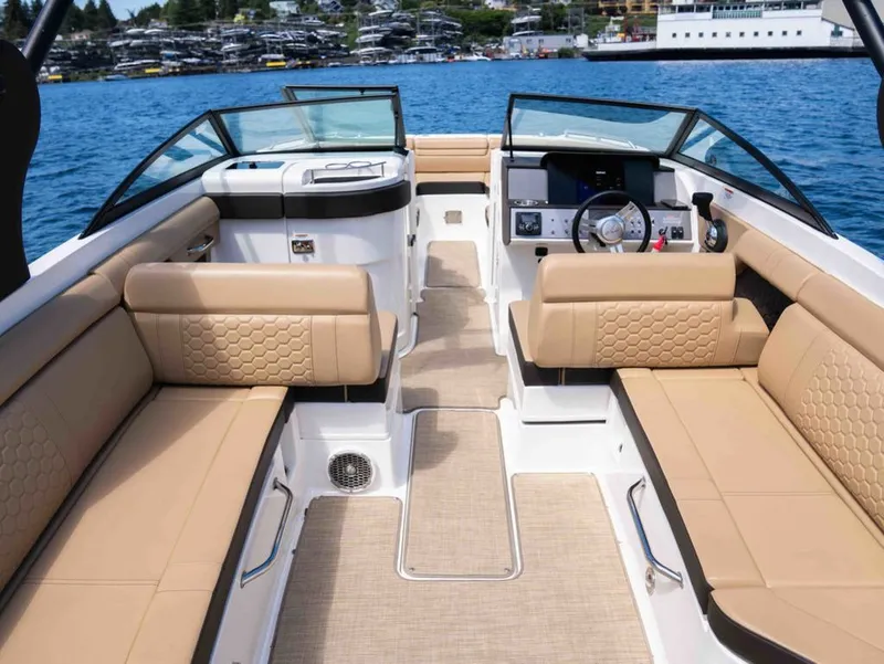Slide: The Image of Interior of a 2018 Sea Ray SDX 270 with beige seating. - 10